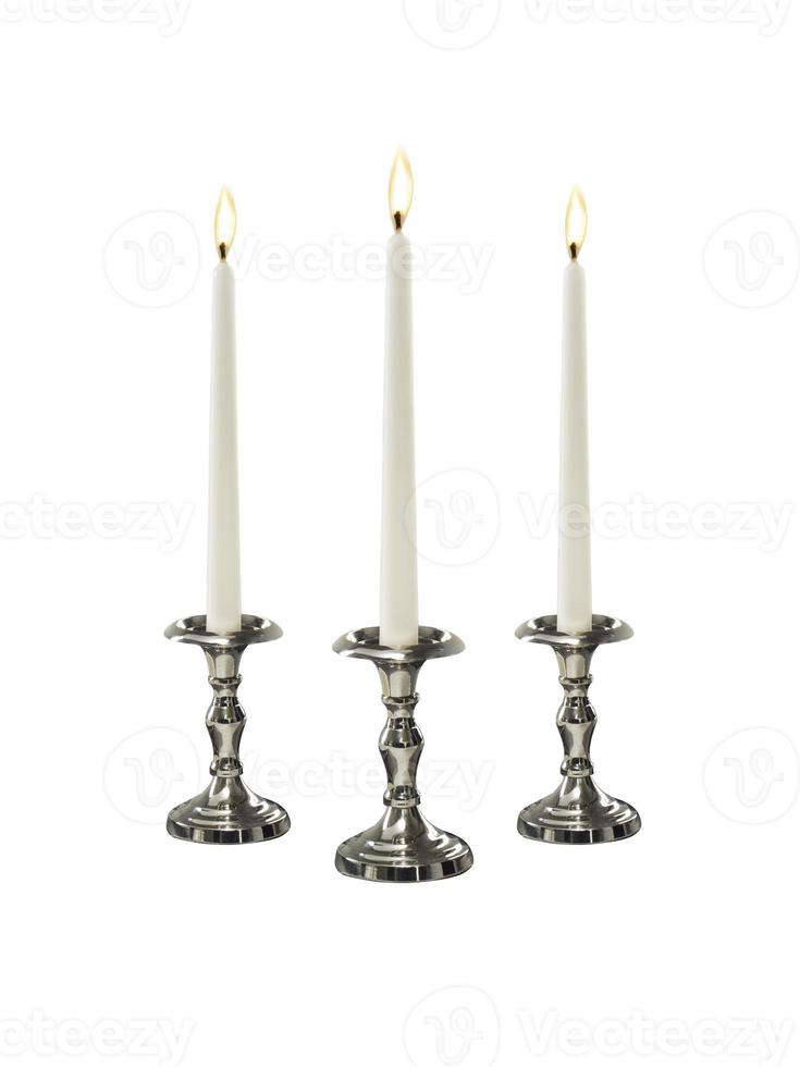 Candle on candlestick isolated on white background photo