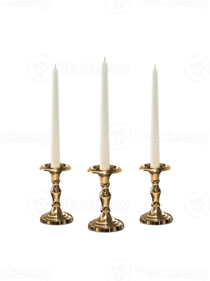 Candle on candlestick isolated on white background photo