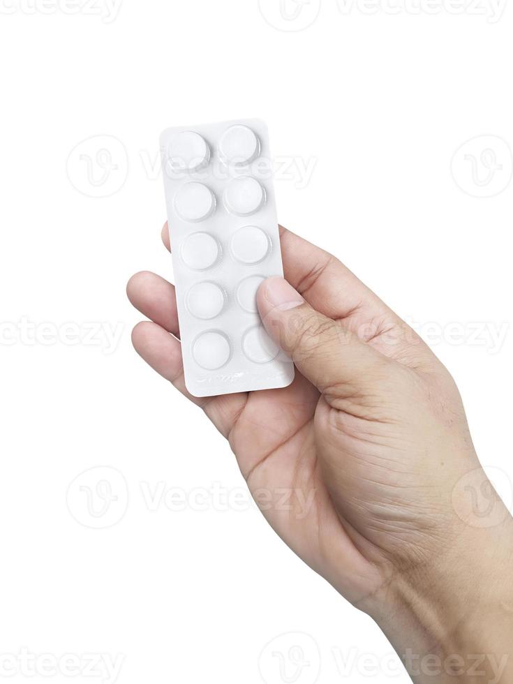 Hand holding medical drugs on white background. Pharmacy and medicine concept photo