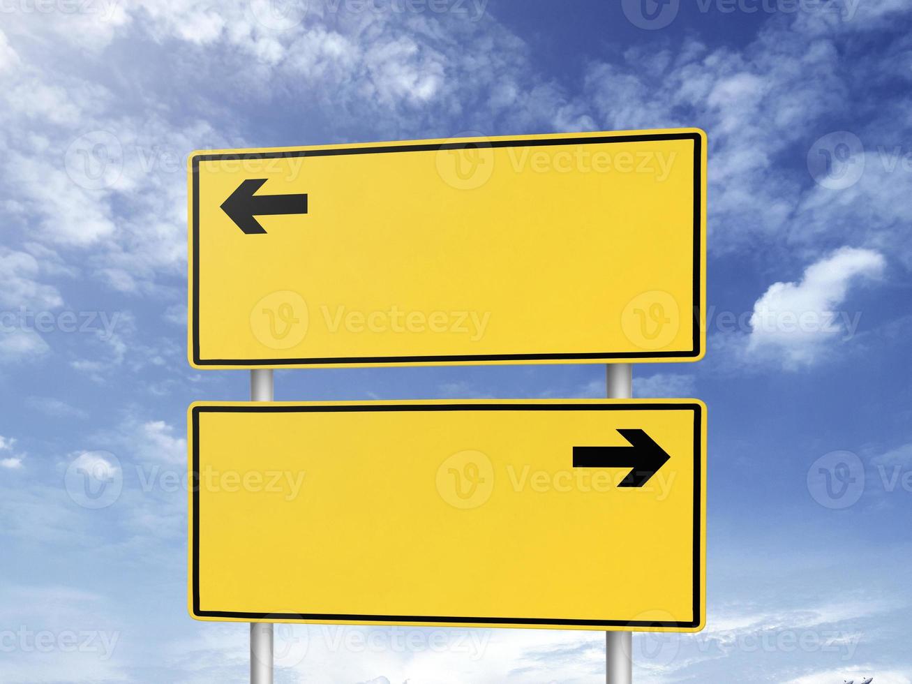 Empty road sign against a background of blue sky with clouds photo