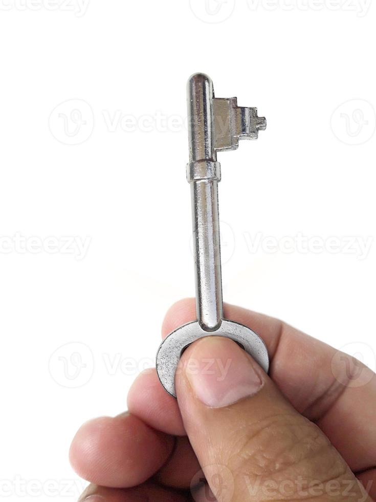 The man holds the keys in hand on a white isolated background photo