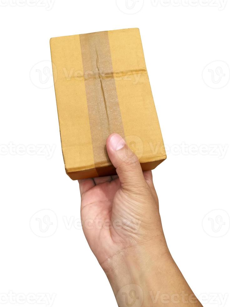 hand holding brown paper box package isolated on white background photo