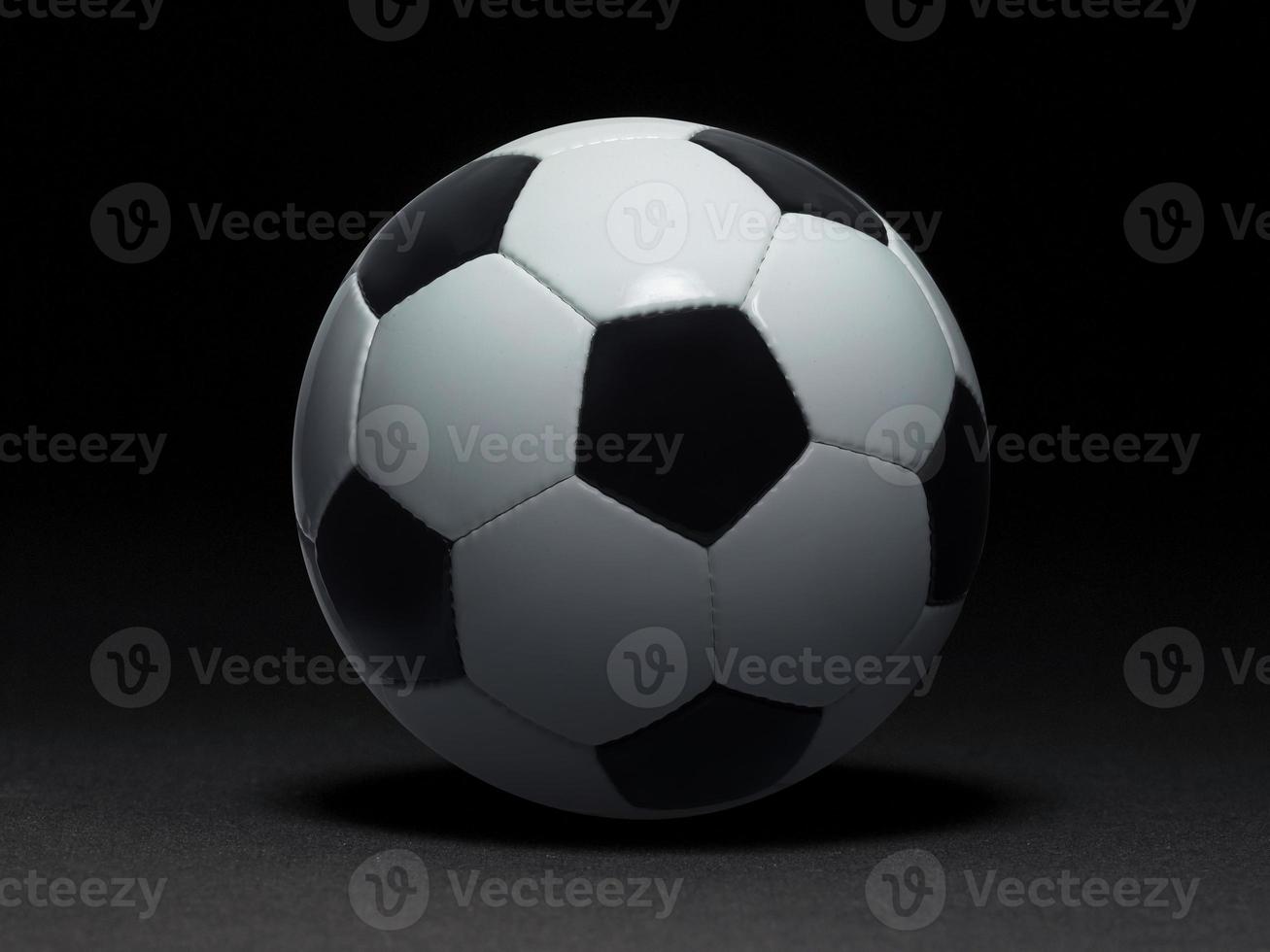 Soccer ball on black background photo