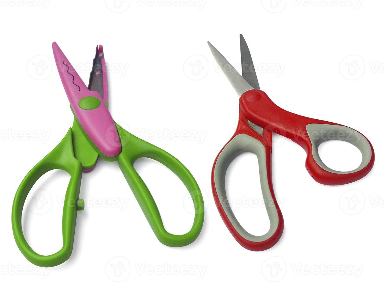 plastic open scissors and Red scissors isolated on a white background photo