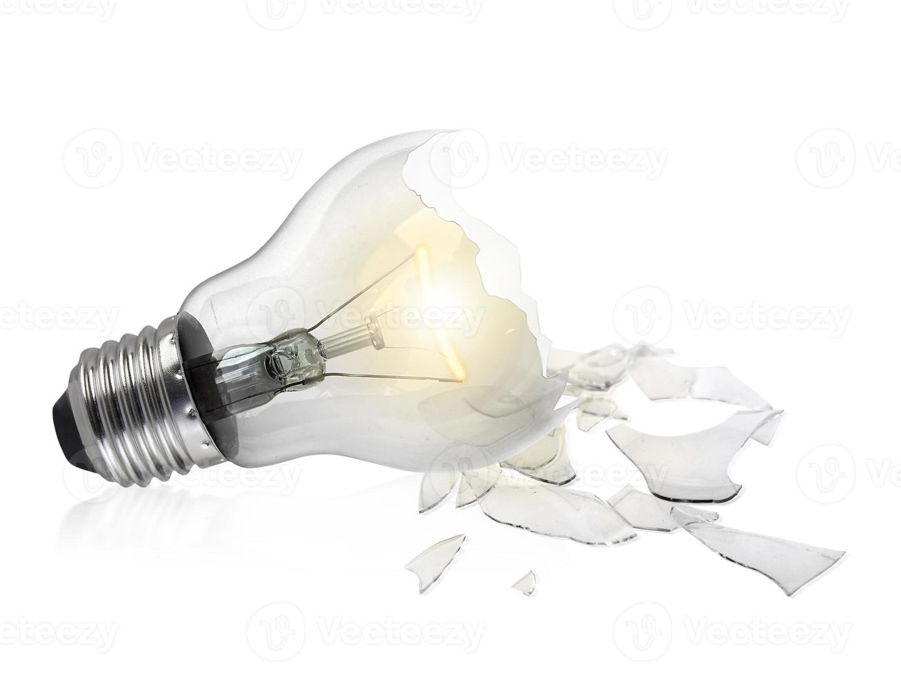 Broken light bulb isolated on white background photo