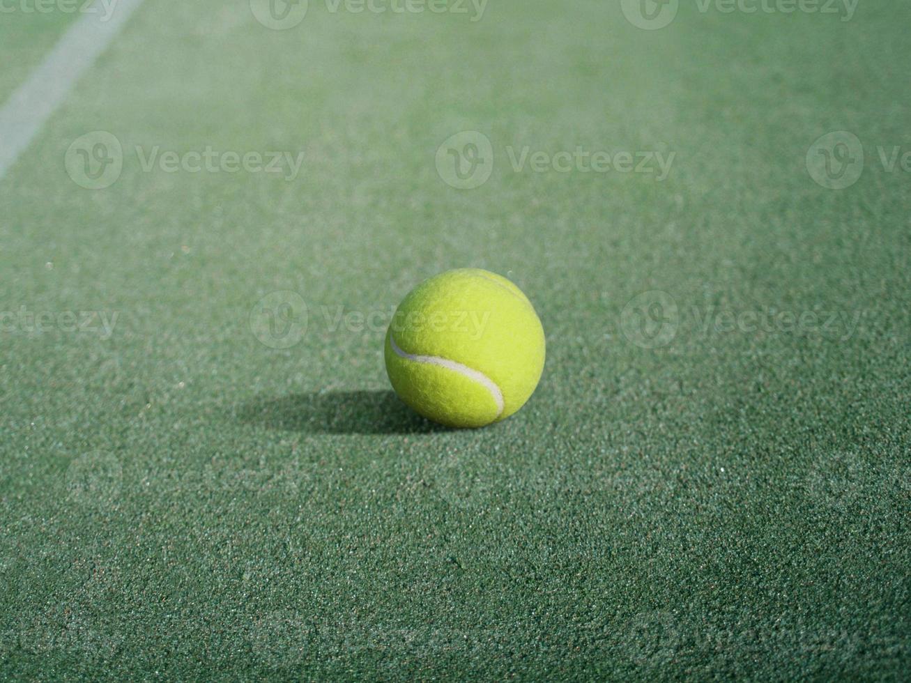 tennis ball in tennis court photo