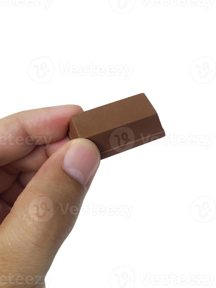 man hand holding. Chocolate isolated on white background photo