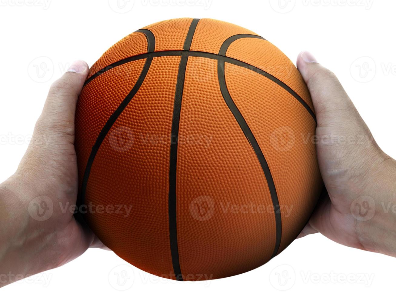 Basketball player holding a ball against white background photo