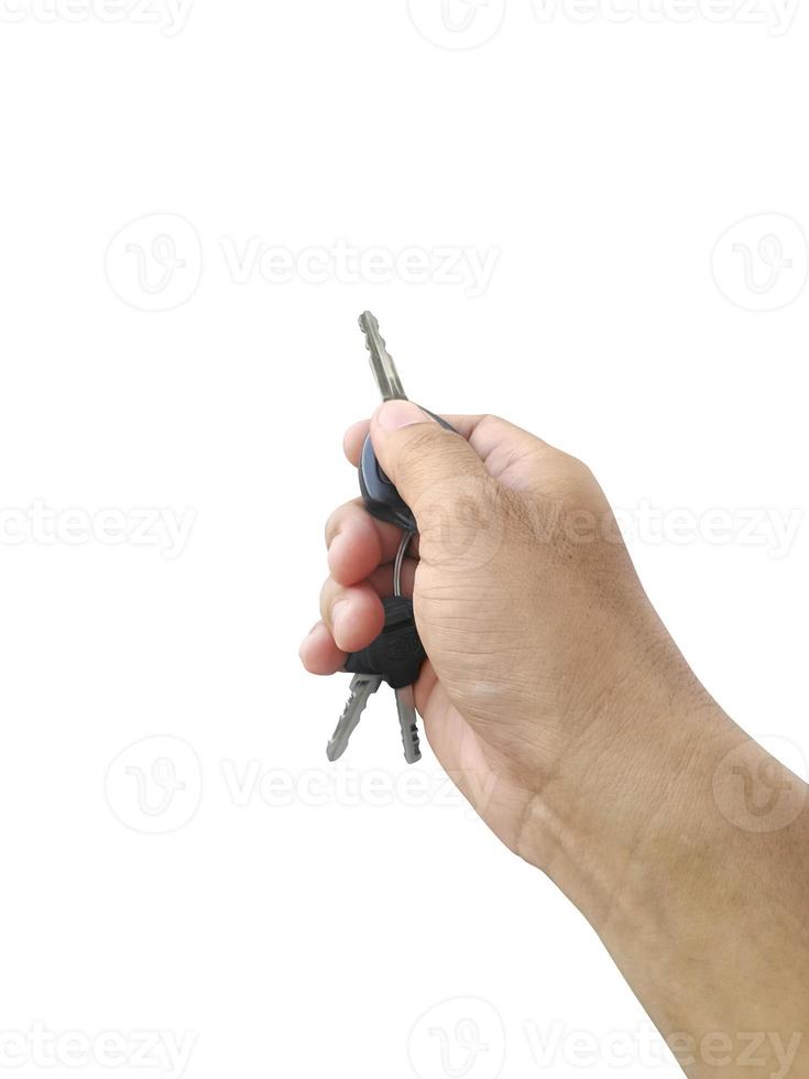 mano con una llave de coche. aislado sobre fondo blanco foto