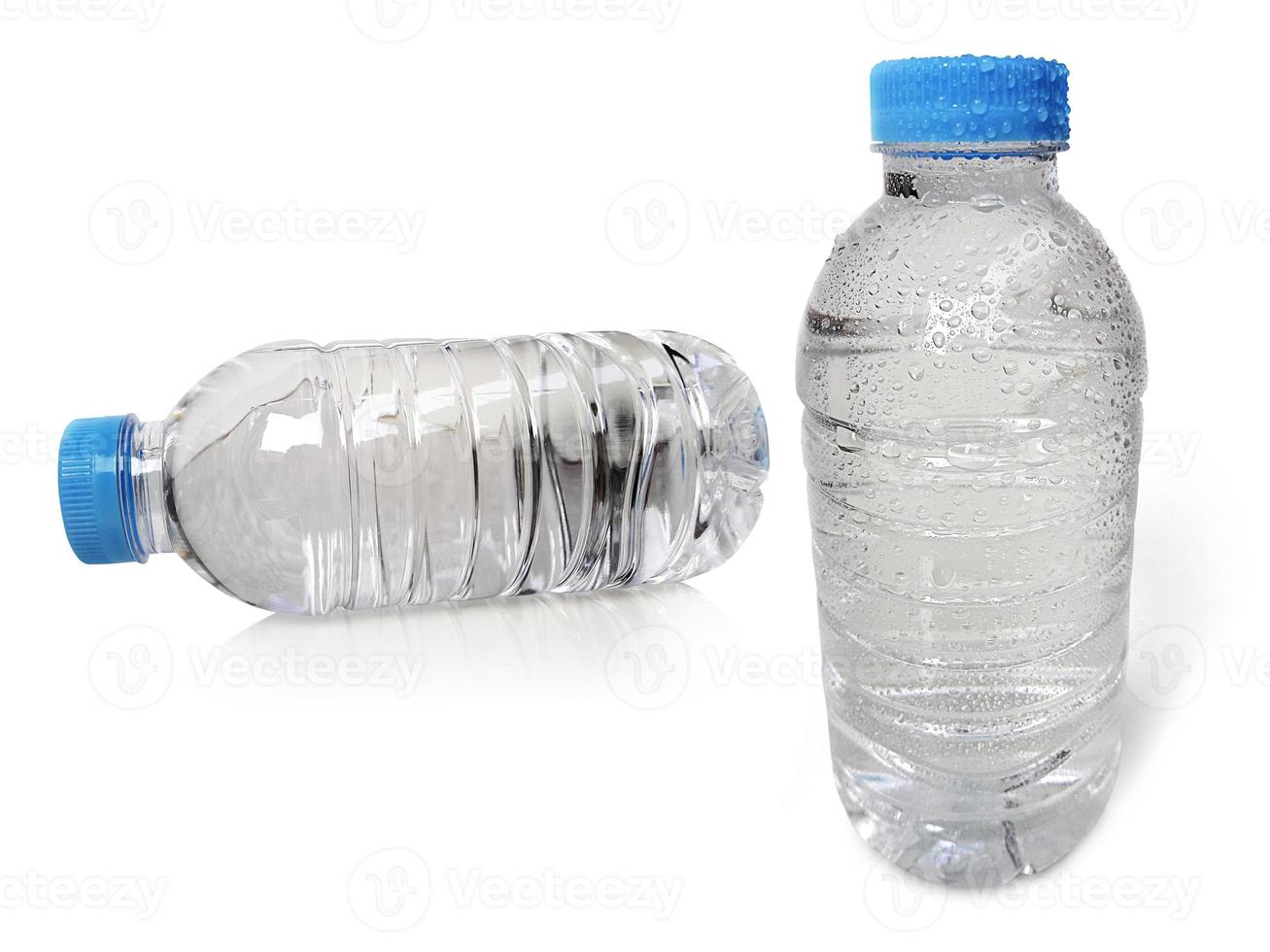 Small plastic water bottle with water drops. isolated on a white background photo