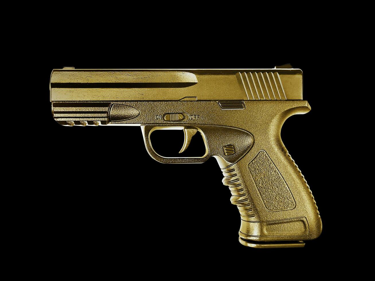 gun gold metal isolated on black background photo