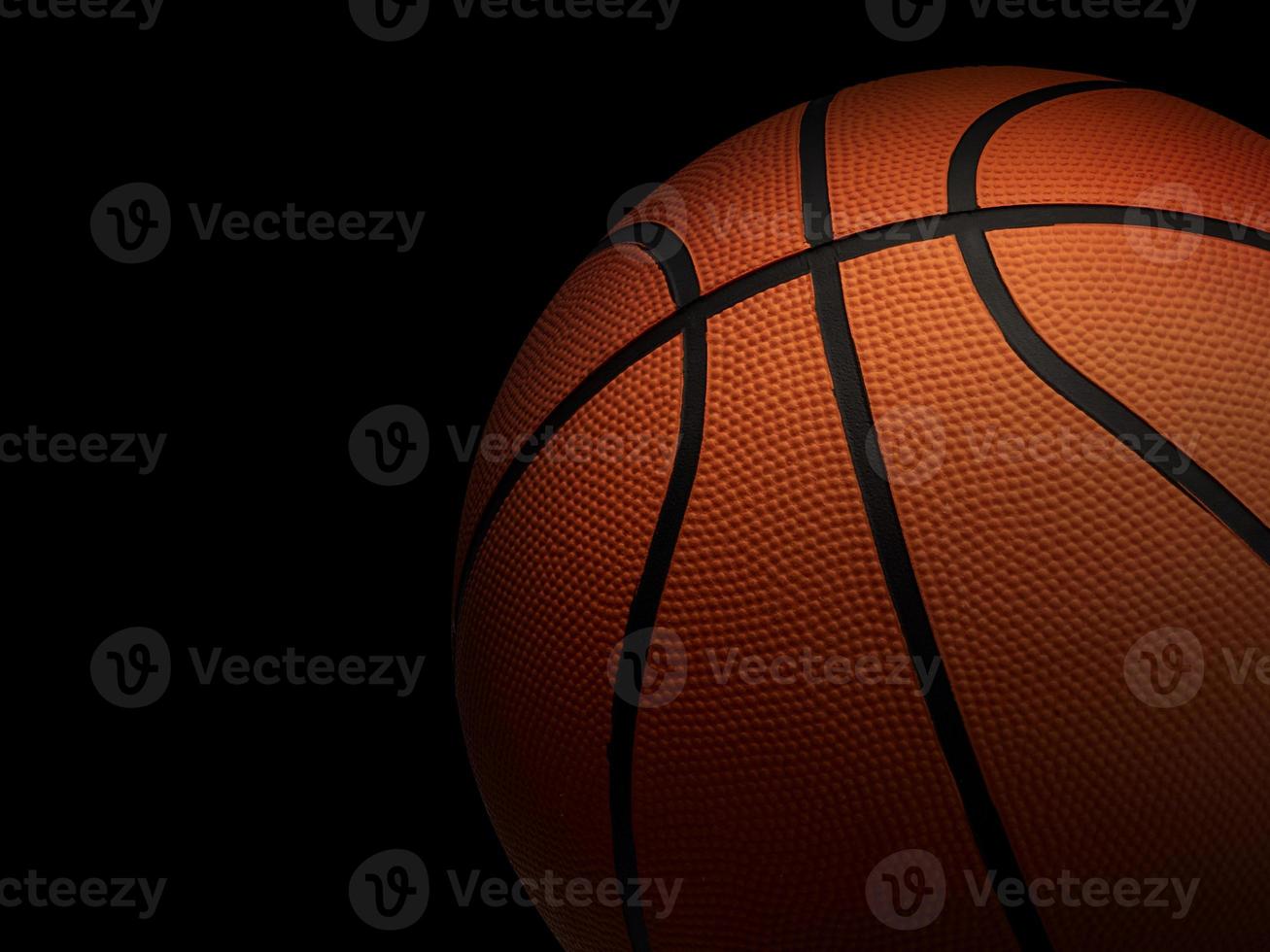 Basketball on black background photo