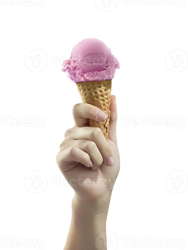 A woman hand holding an ice cream cone on a white background photo
