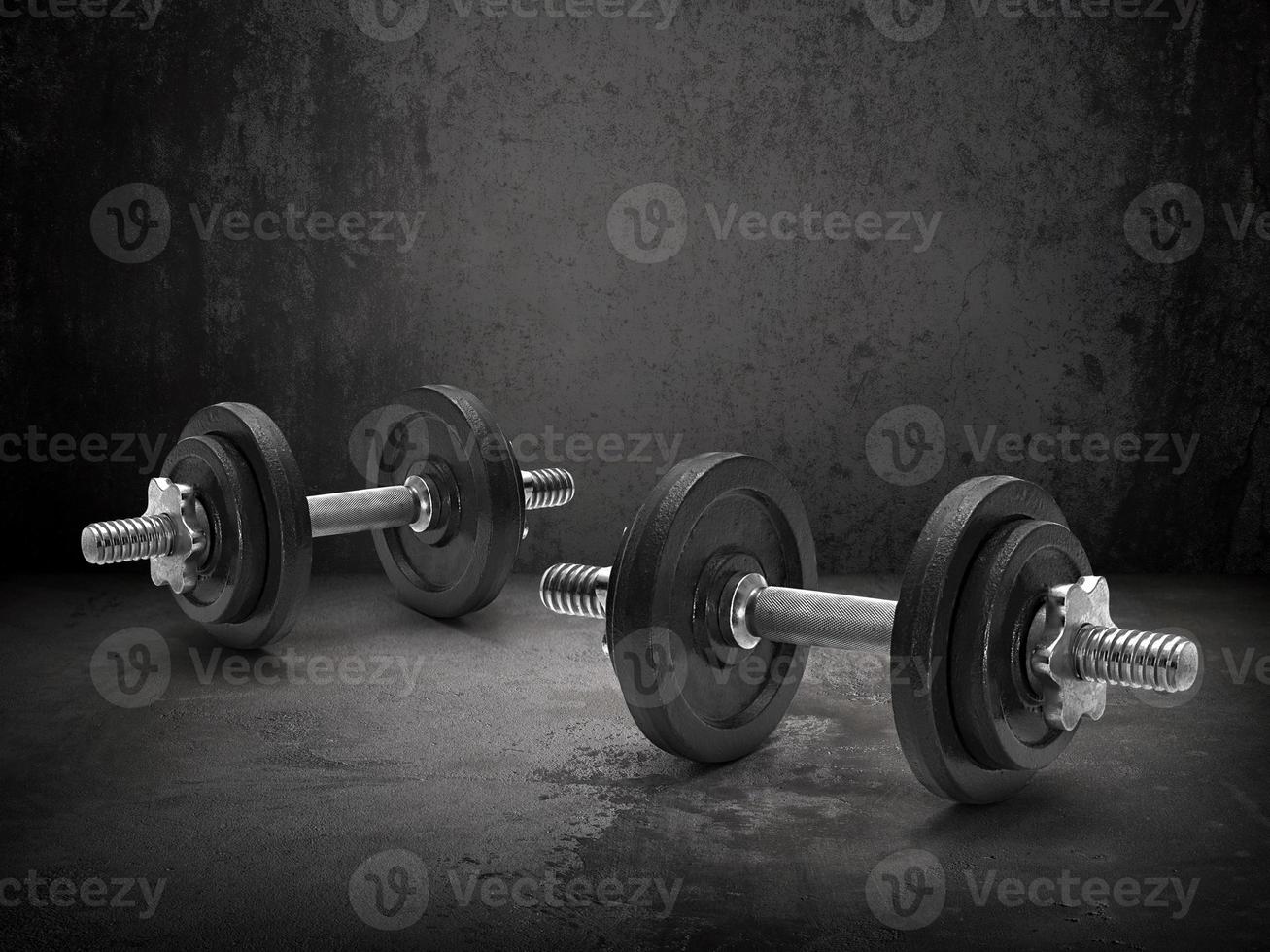 Dark gym interior with steel dumbbells photo