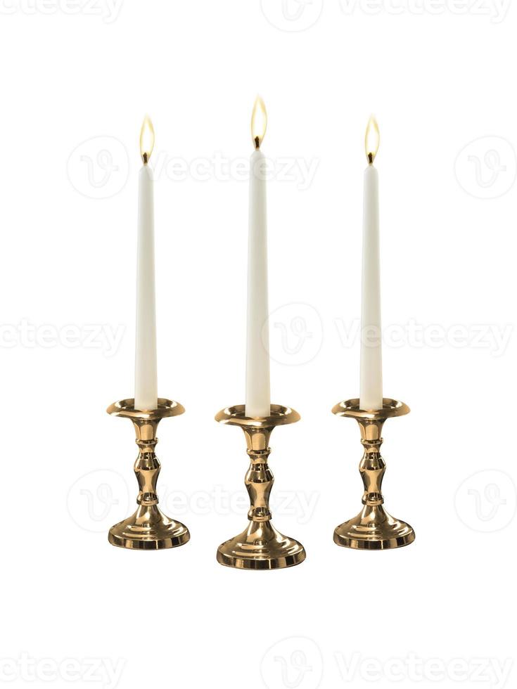 Candle on candlestick isolated on white background photo