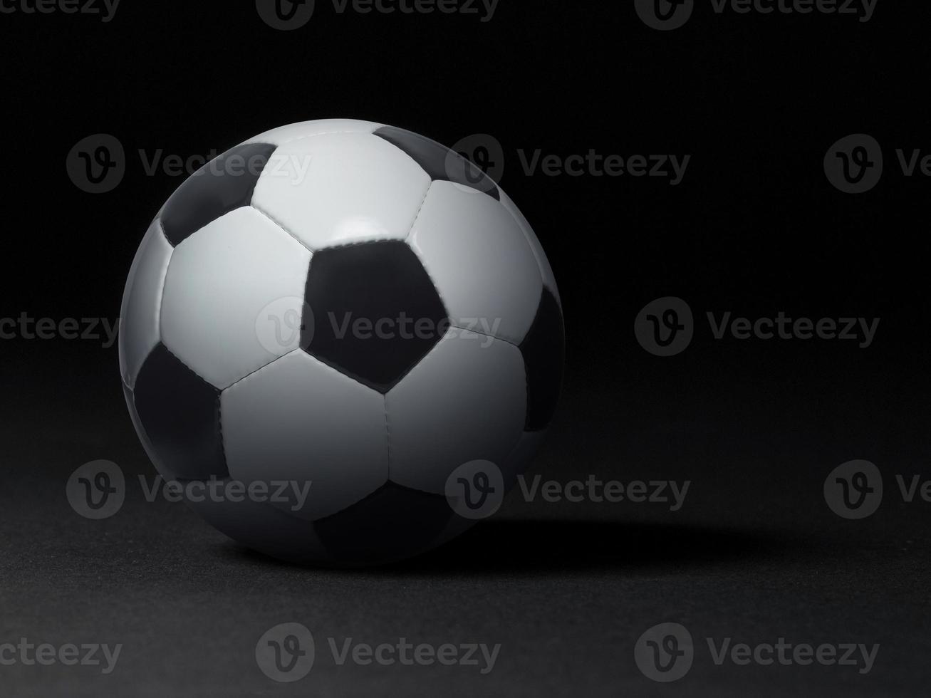 Soccer ball on black background photo