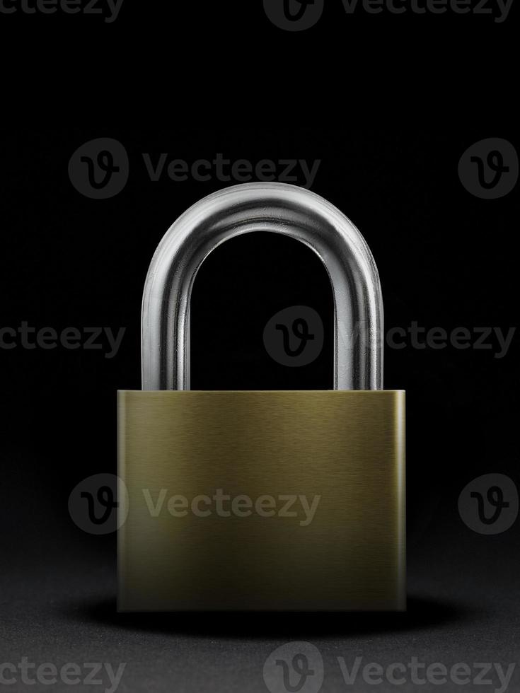 Metal padlock on black background photo