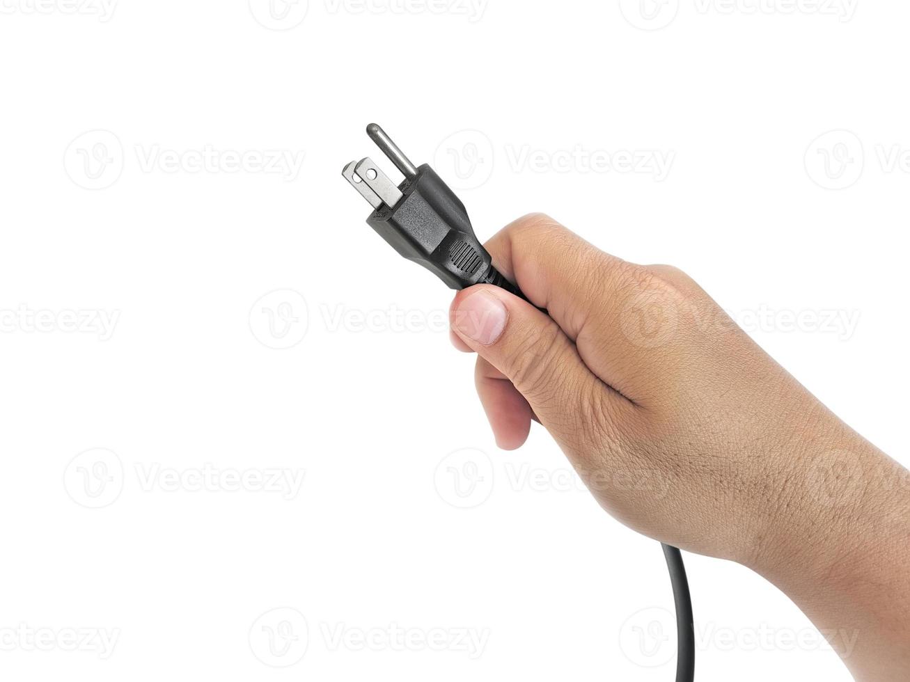 close-up of male hand holding electric plug photo