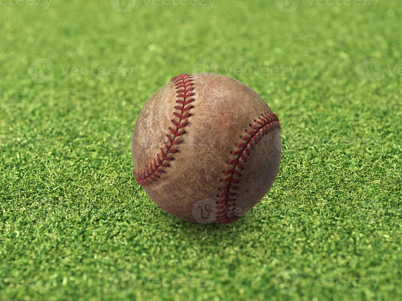 Baseball on the clear green grass turf close-up. Top view photo