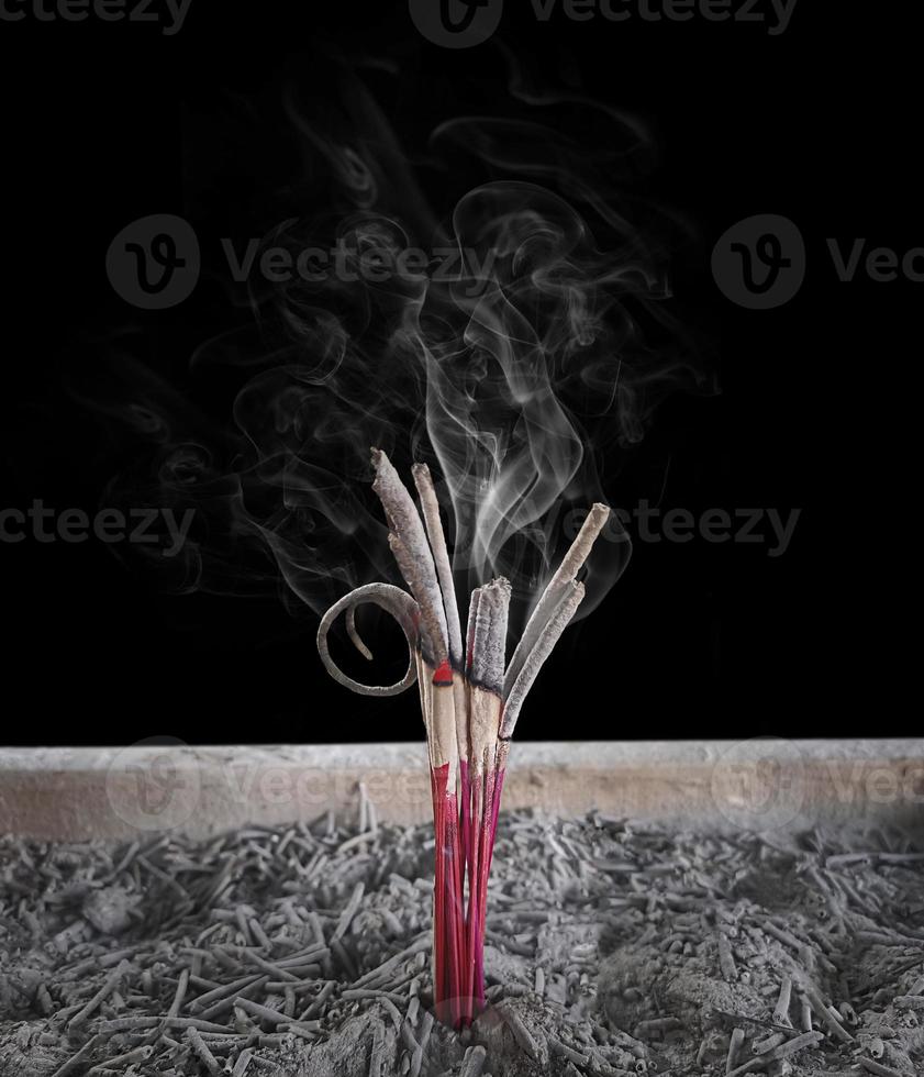 Incense burning Embossed in an incense pot. There is a lot of smoke photo