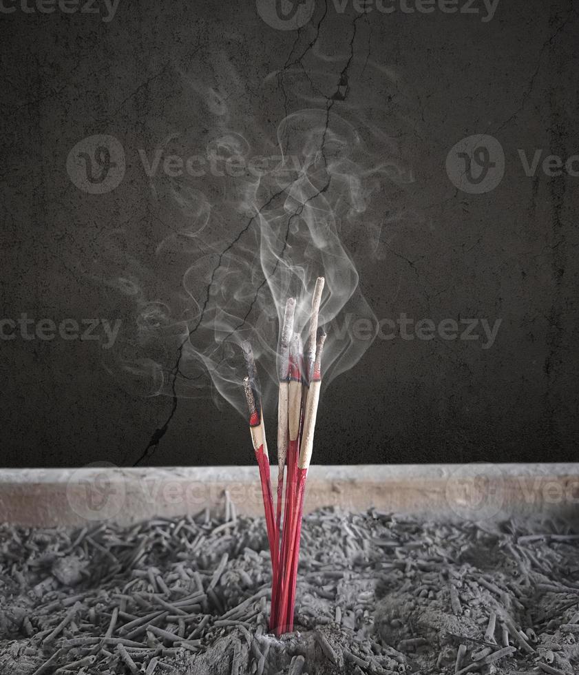 Incense burning Embossed in an incense pot. There is a lot of smoke photo