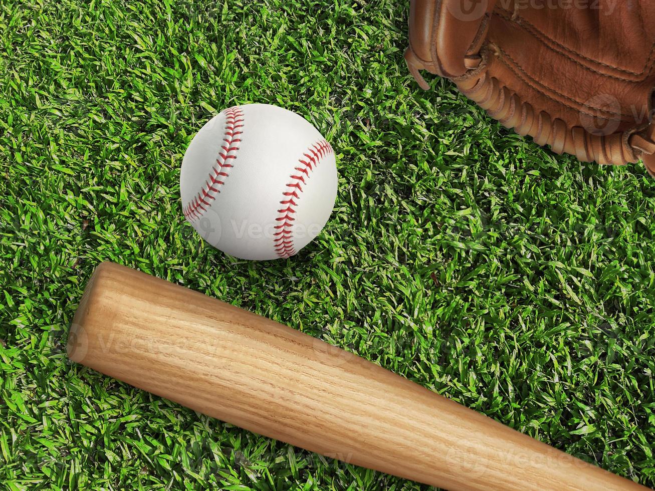 baseball, glove, ball and bat on field photo