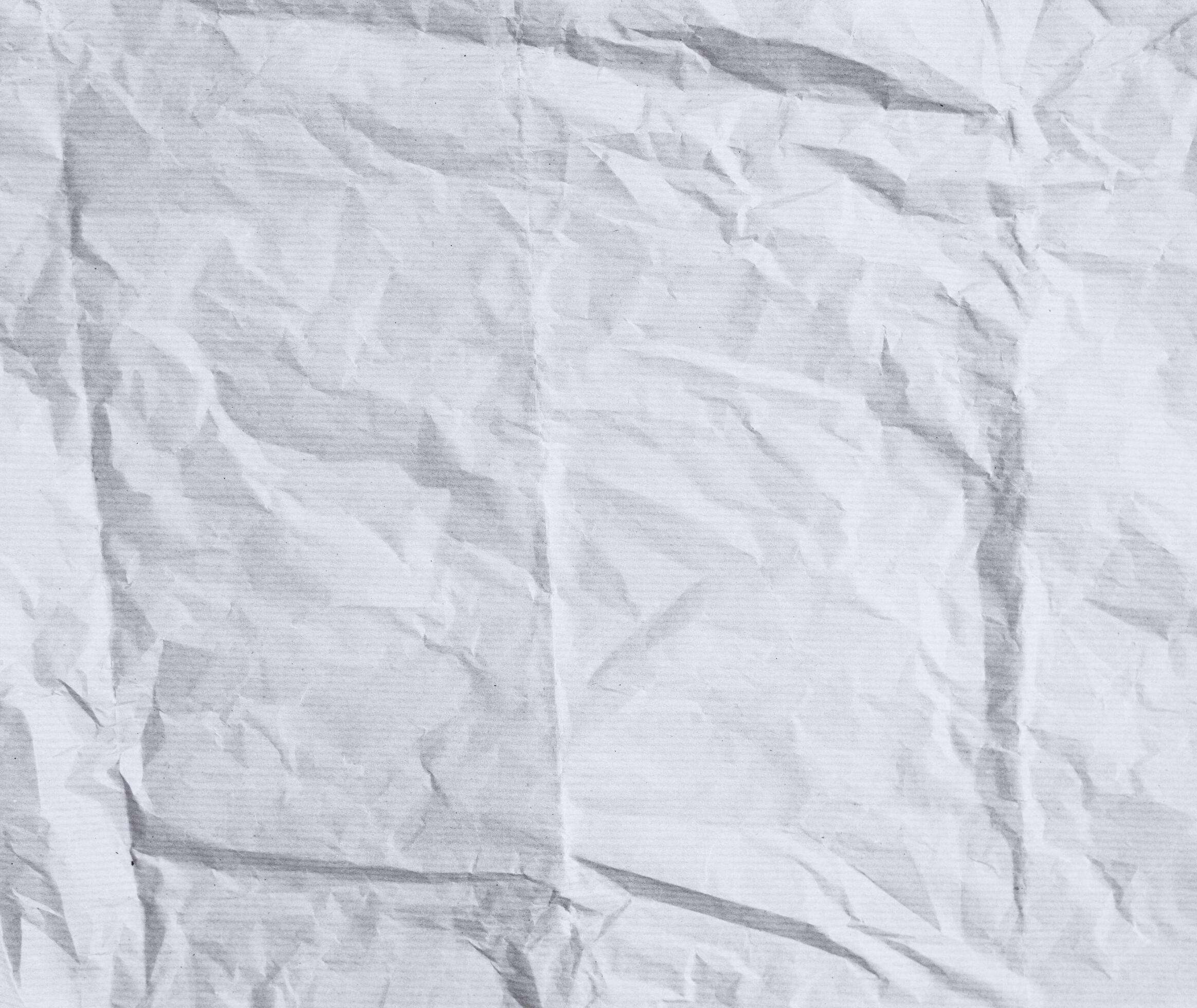 Rough paper texture for background. Crumpled striped white paper with a
