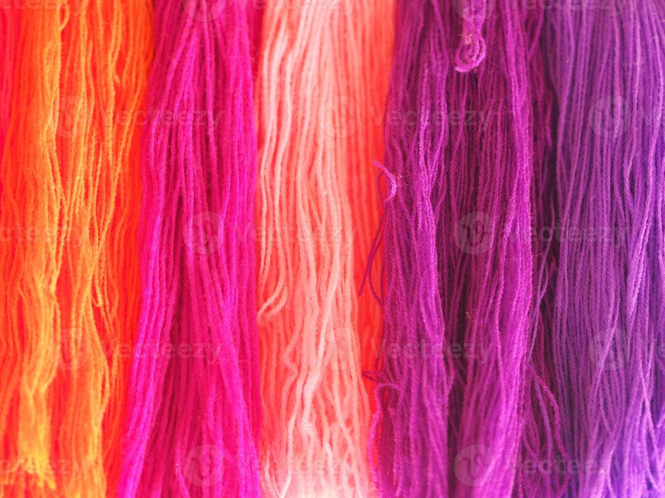 Yarn, several colors arranged abstract Gradient for background, Garn colorful pink orange red purple violet gold o-rose dark and soft color photo