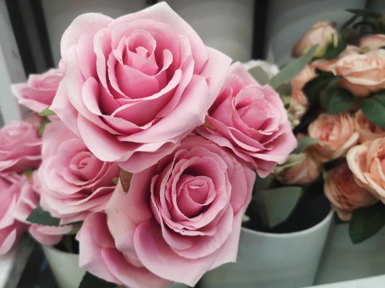 Pink Rose handmade Beautiful Artificial bouquet flowers decoration ornamental background for greeting card or celebration event design Retro, made from fabric and plastic, Valentine Day photo