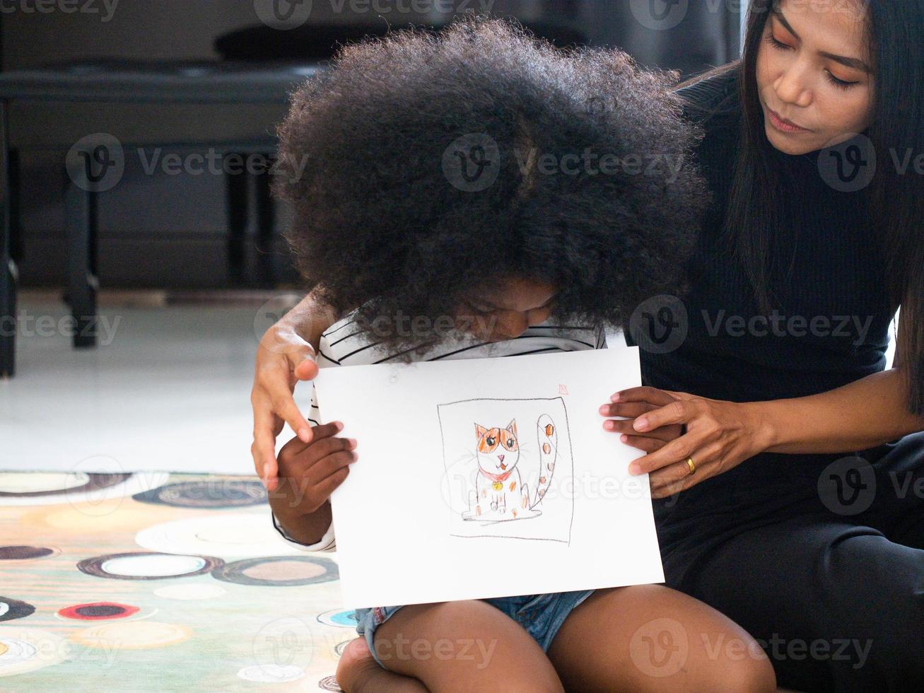 Child girl son person creative idea drawing art picture family mother young adult education fun enjoy show paper happy smile black african person indoor home house paint together love activity photo