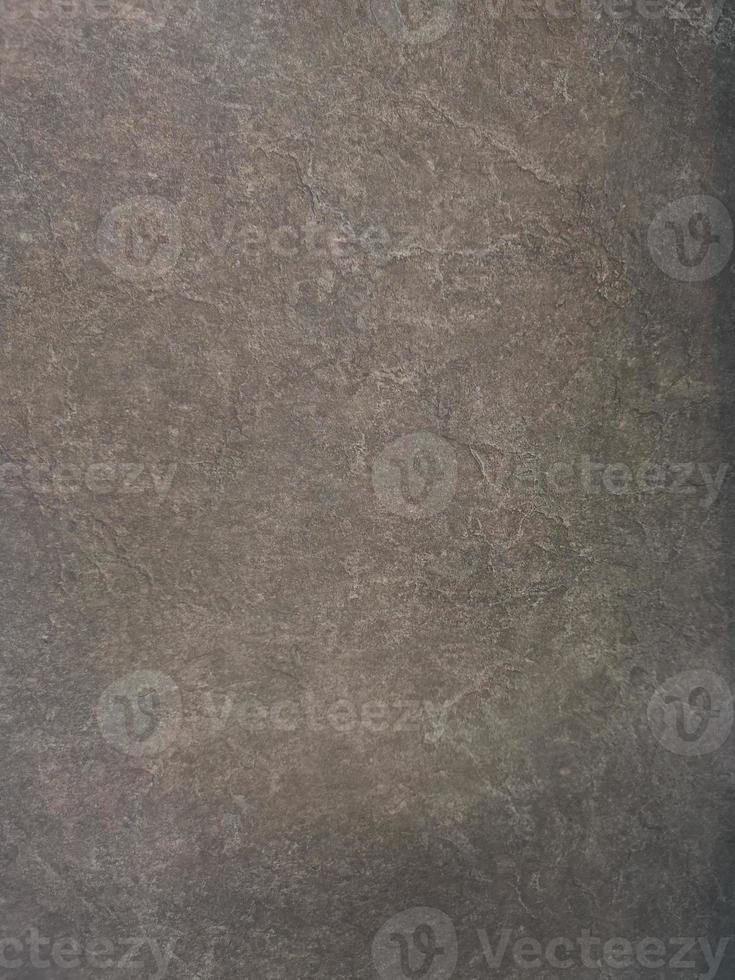 Granite stone wall black color rough surface texture material background photo