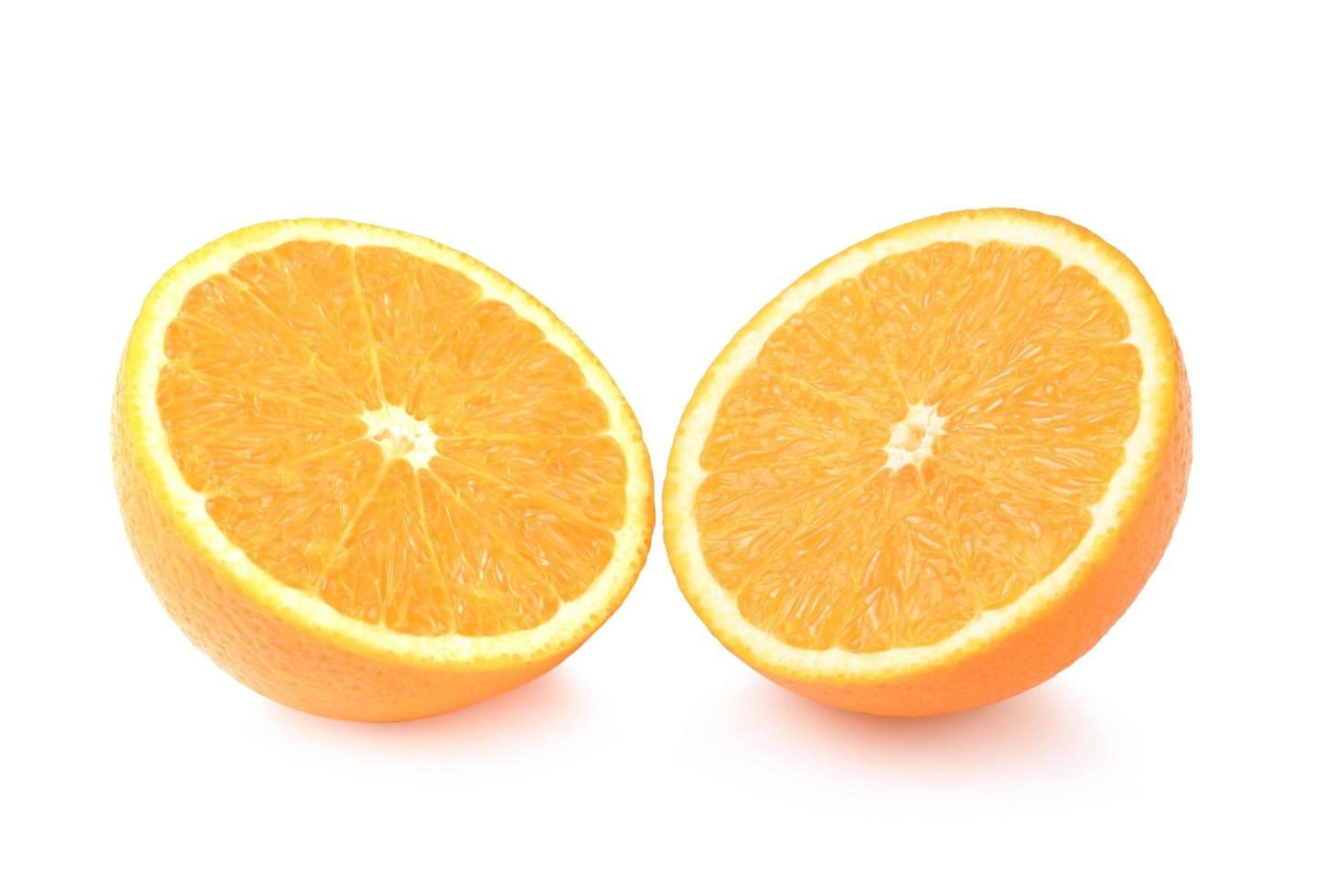 Slices of ripe orange fruits isolated on white background photo