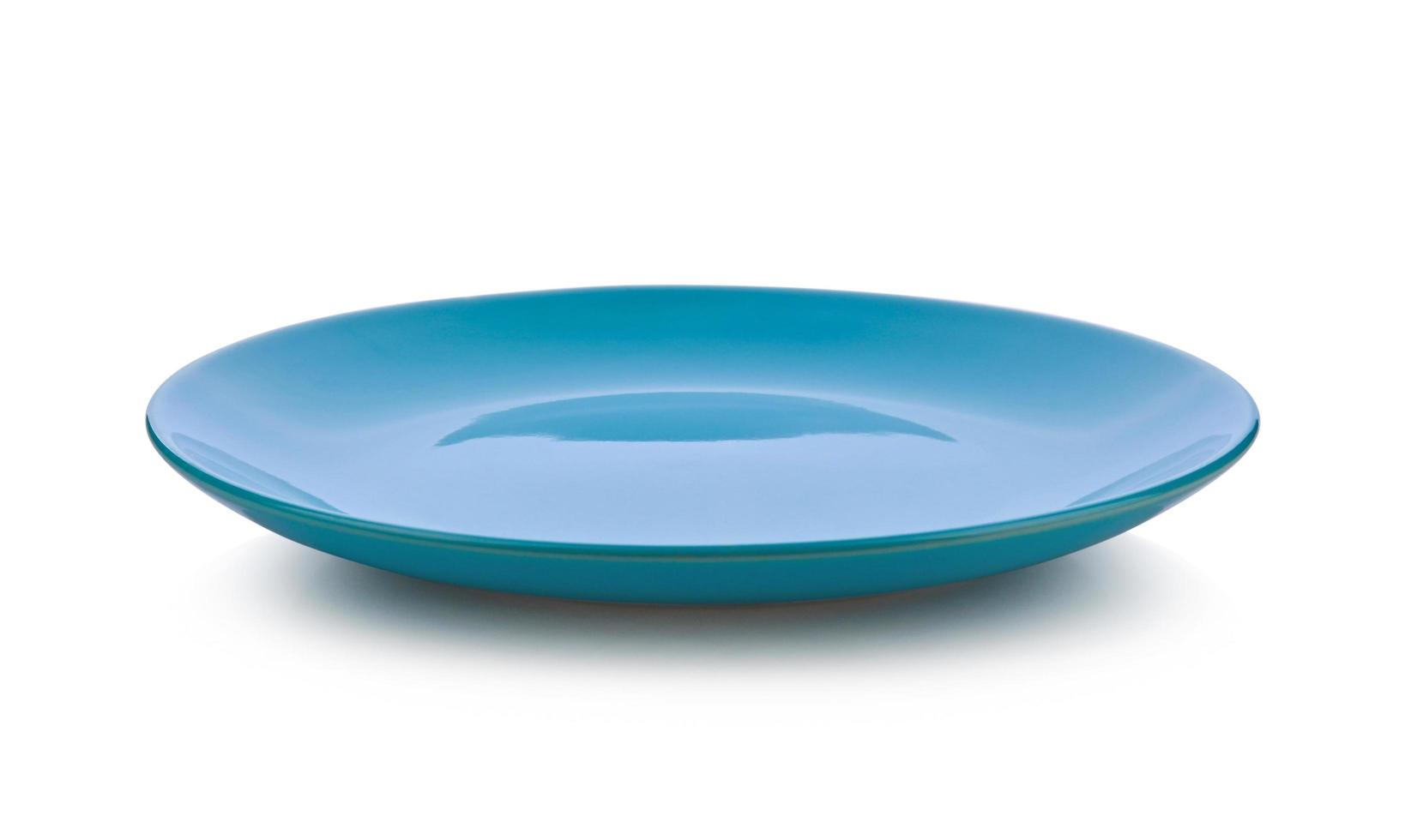 Blue ceramic plate isolated on white background. photo