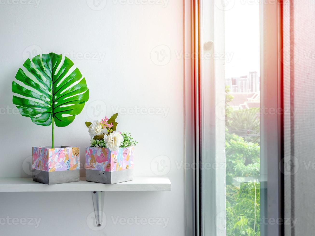 Modern geometric concrete planters. Beautiful painted concrete pots. photo