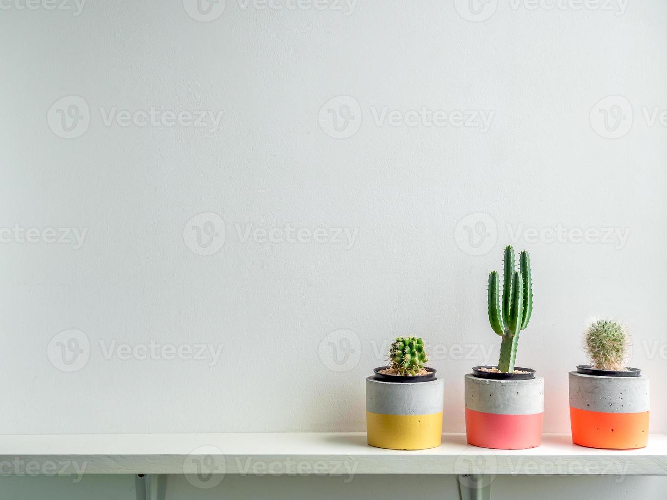 Modern geometric concrete planters. Beautiful painted concrete pots. photo