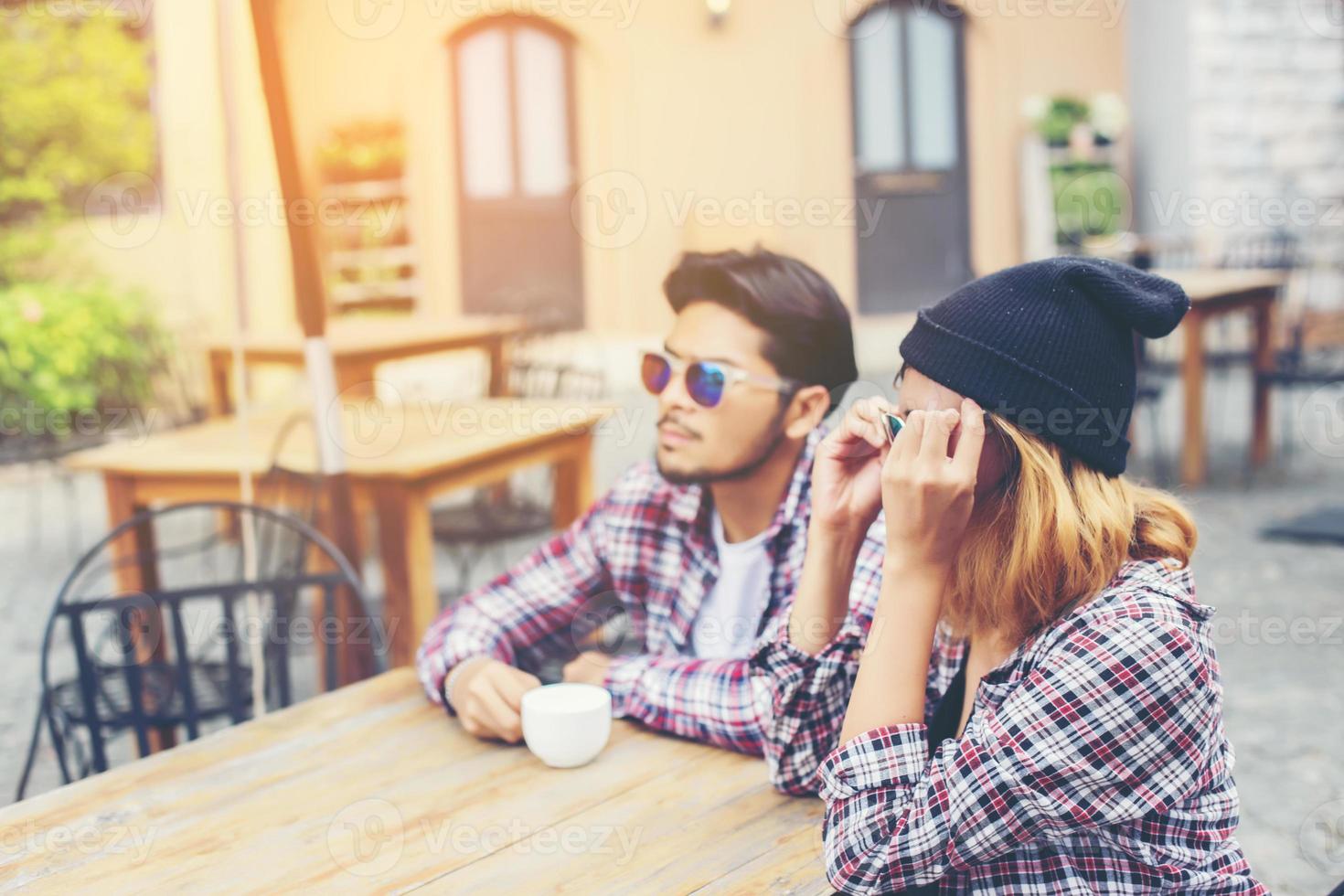 Group of young hipster sitting in a cafe,Young cheerful friends having fun while take time together, Holiday freedom enjoy. photo