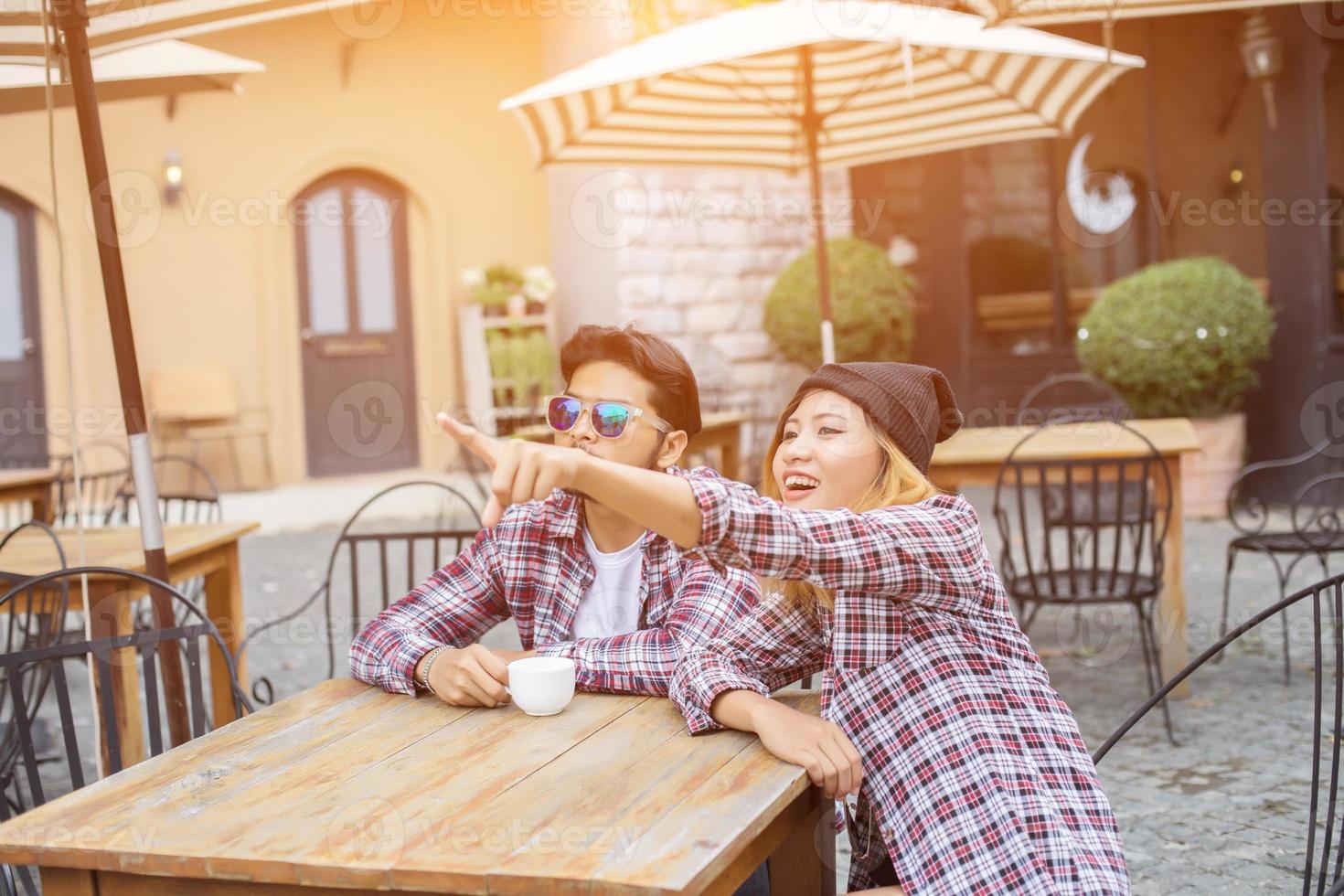 Group of young hipster sitting in a cafe,Young cheerful friends having fun while take time together, Holiday freedom enjoy. photo