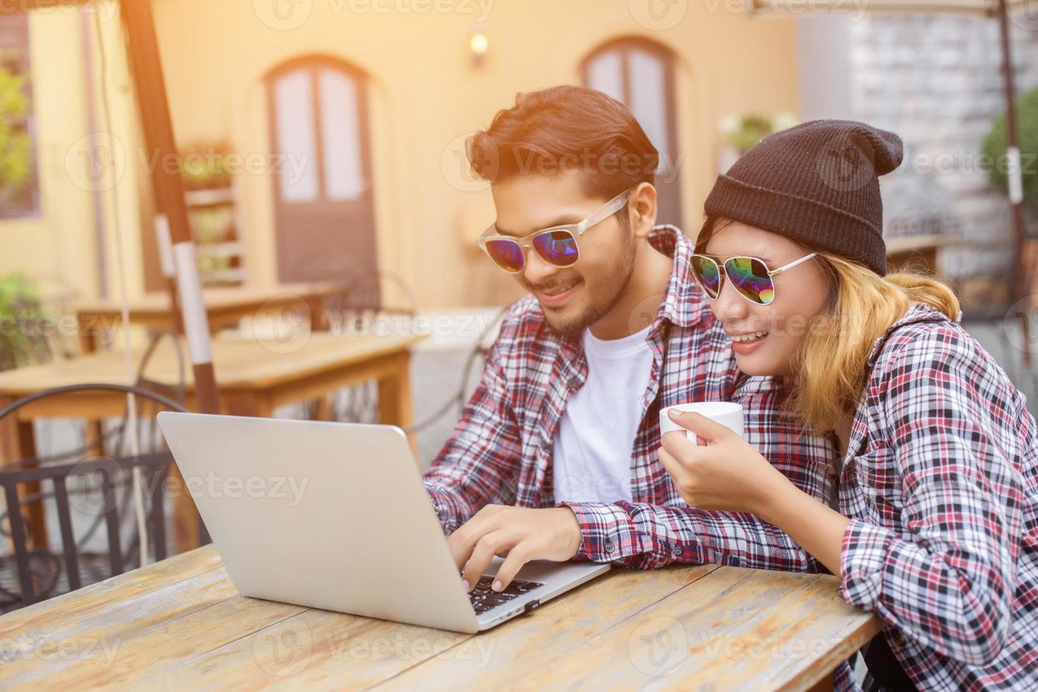 Group of young hipster sitting in a cafe,Young cheerful friends having fun while take time together, Holiday freedom enjoy. photo