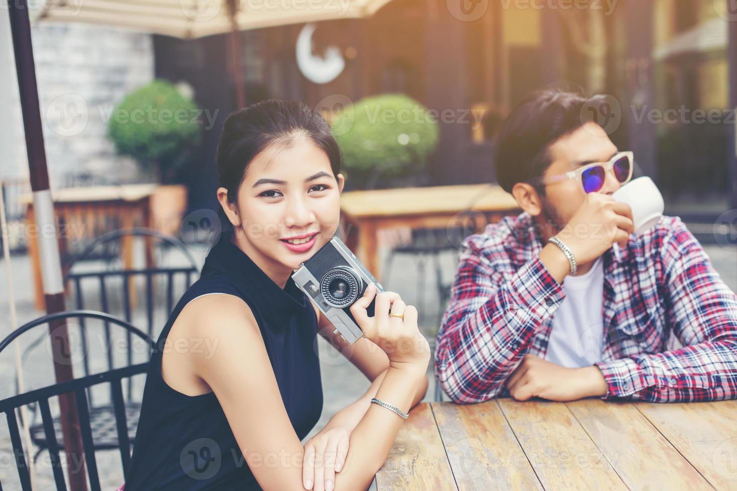 Group of young hipster sitting in a cafe,Young cheerful friends having fun while take time together, Holiday freedom enjoy. photo