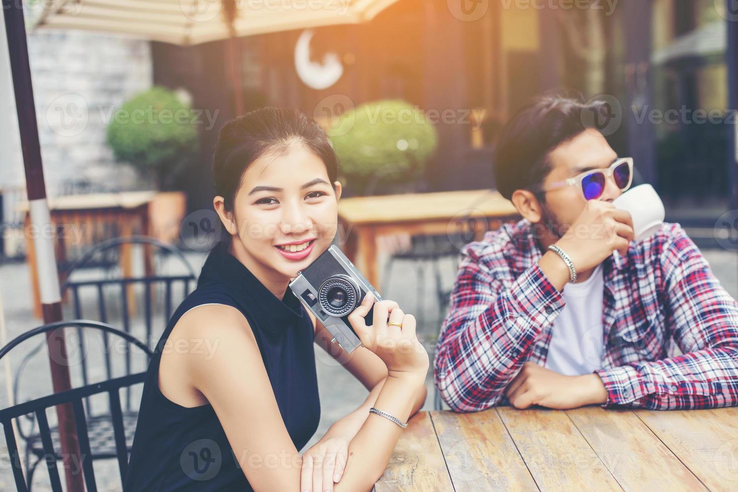 Group of young hipster sitting in a cafe,Young cheerful friends having fun while take time together, Holiday freedom enjoy. photo