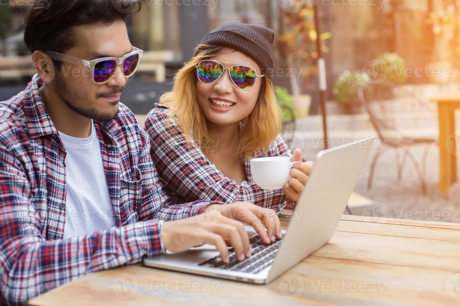 Group of young hipster sitting in a cafe,Young cheerful friends having fun while take time together, Holiday freedom enjoy. photo