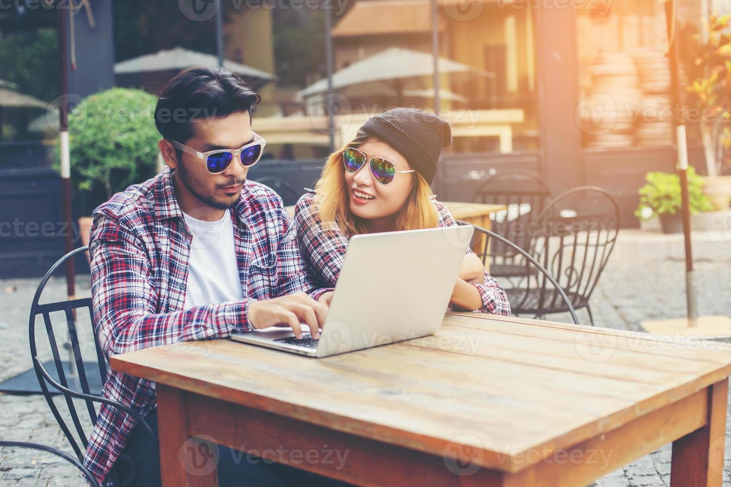 Group of young hipster sitting in a cafe,Young cheerful friends having fun while take time together, Holiday freedom enjoy. photo