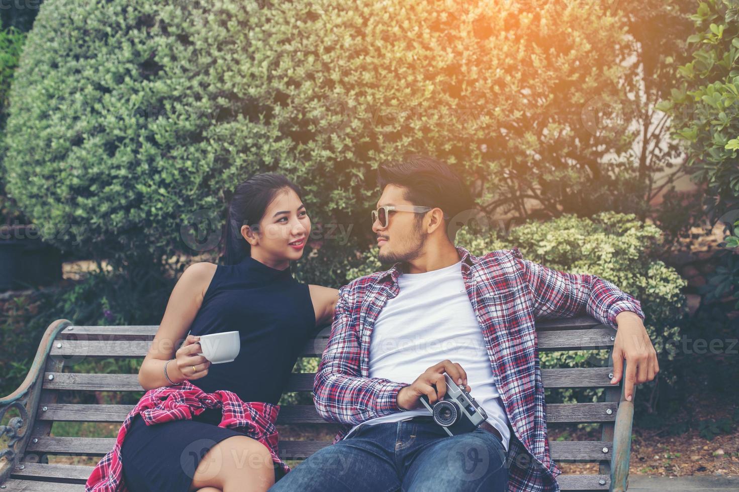 Young hipster couple teenagers in love in the city, Summer holiday enjoyment together. photo