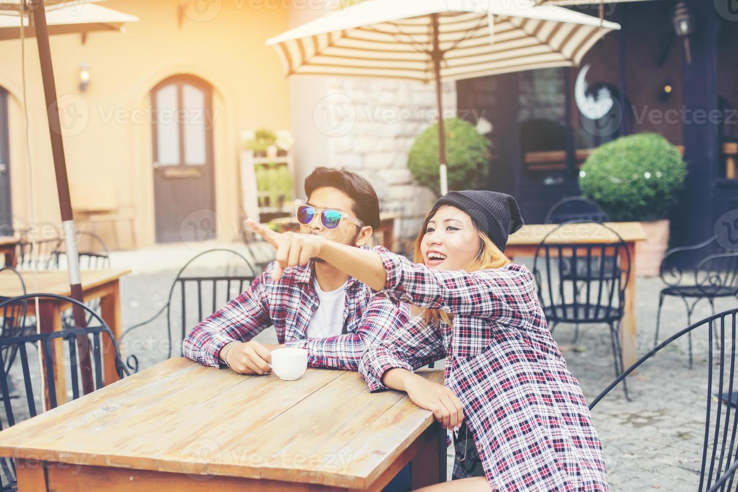 Group of young hipster sitting in a cafe,Young cheerful friends having fun while take time together, Holiday freedom enjoy. photo