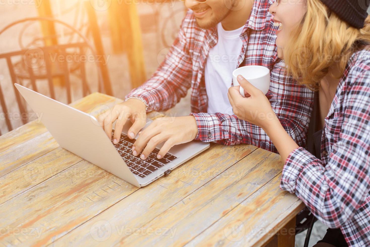 Group of young hipster sitting in a cafe,Young cheerful friends having fun while take time together, Holiday freedom enjoy. photo