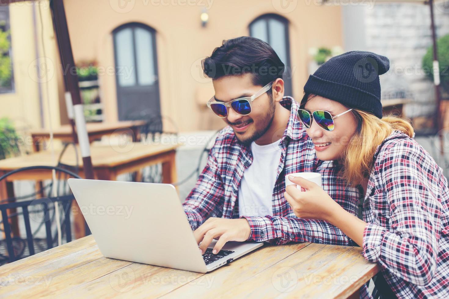 Group of young hipster sitting in a cafe,Young cheerful friends having fun while take time together, Holiday freedom enjoy. photo