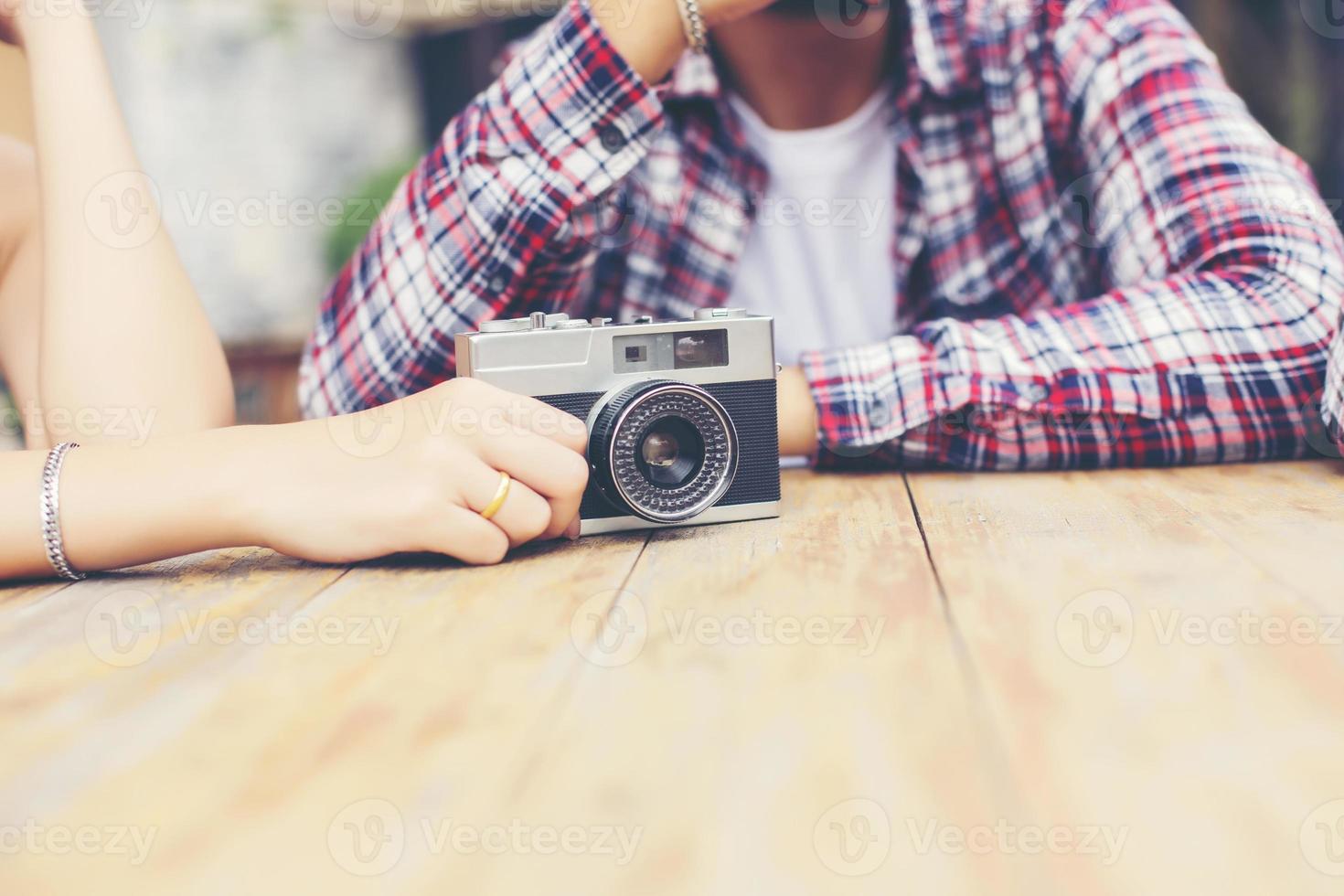 Group of young hipster sitting in a cafe,Young cheerful friends having fun while take time together, Holiday freedom enjoy. photo