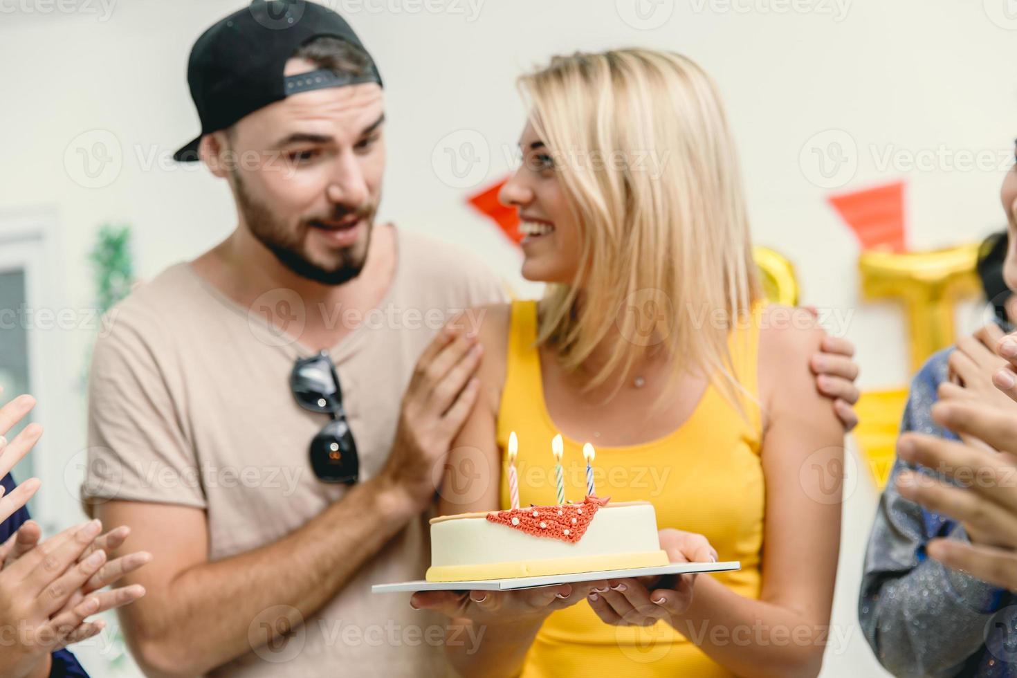 Friend surprise woman with birthday cake and party to beautiful women she very happy and smile. photo