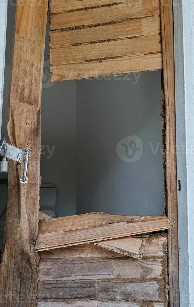 old wood door with termites damage photo