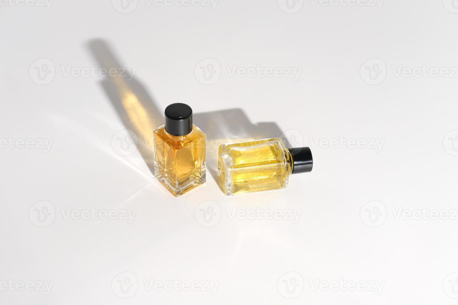 perfume bottles on a white background. travel size fragrance bottles photo